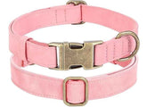 Pink leather dog collar with adjustable buckle, stylish and durable for pets. Perfect for all dog sizes.